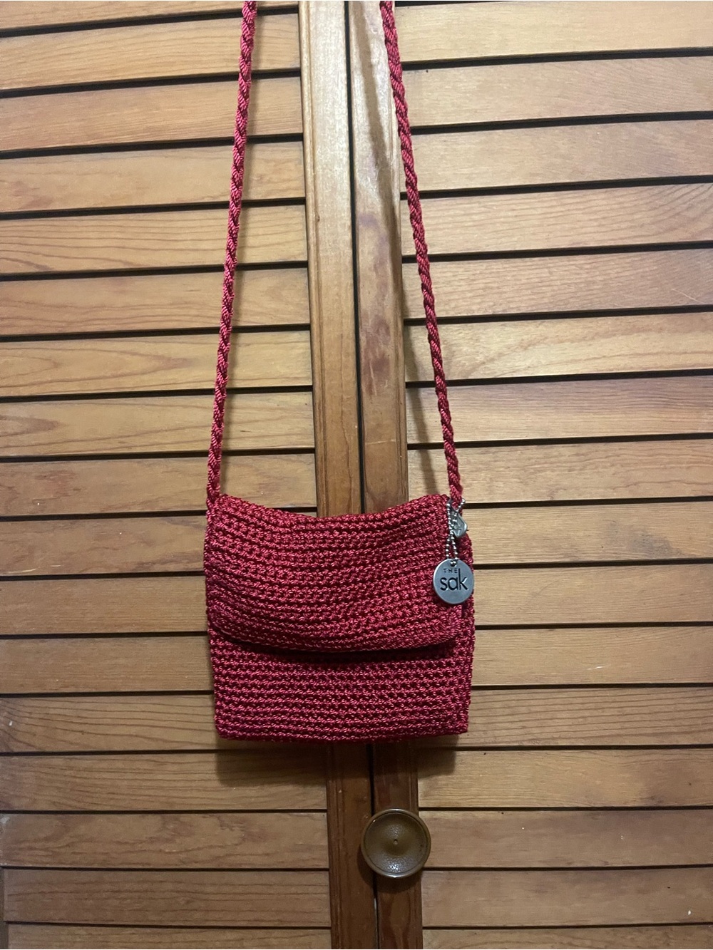 The Sak Crimson Crochet Shoulder Bag with Silver Charm